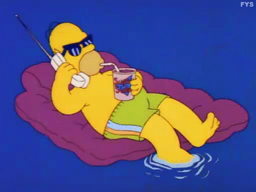 Homer Simpson floating leisurely in a pool with sunglasses on, having a drink and talking on a cell phone.